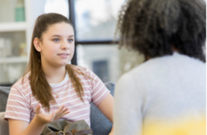 Girl speaking with counselor